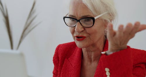 An Elderly Woman Talking in a Video Call