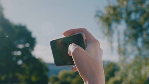 Women Talking a Picture using a Smartphone