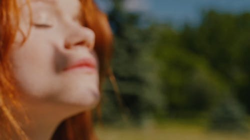 An Extreme Close Up of a Woman on a Sunny Day