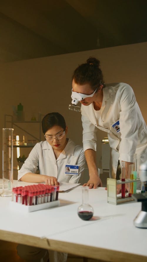 Scientists Looking at Notes in a Lab