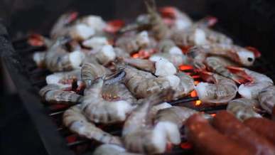 grilling shrimp and sausages