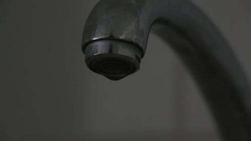 Water Dripping From Faucet