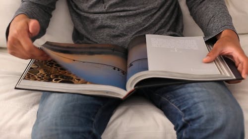 Person Scanning Through A Book