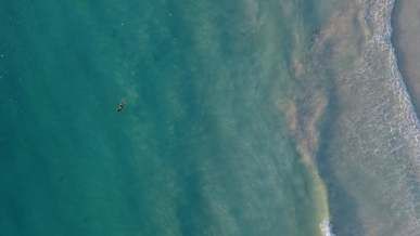aerial shot of woman floating