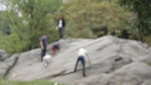 Blurred Video Of Family Climbing Rock