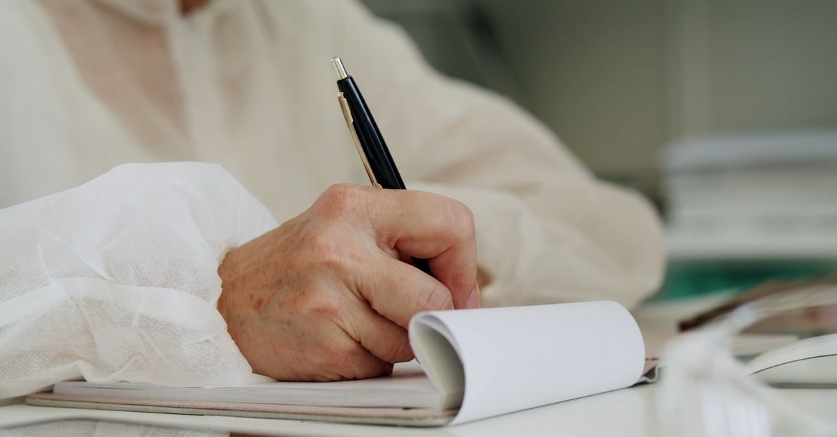 A Person Writing on a Notepad Free Stock Video Footage, Royalty-Free 4K ...