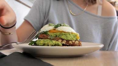 woman eating a healthy sandwich