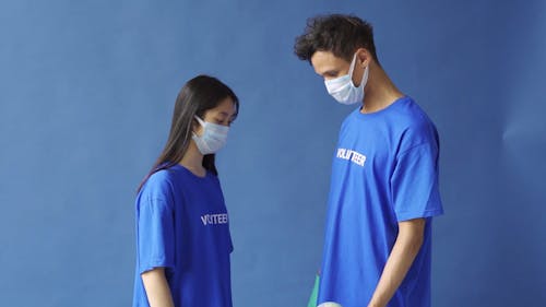 Volunteers Holding a Globe