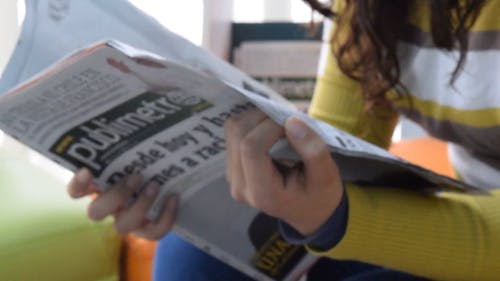 Woman Reading Newspaper