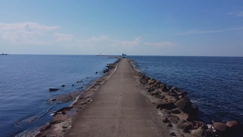 An Aerial Footage of a Pathway on the Sea