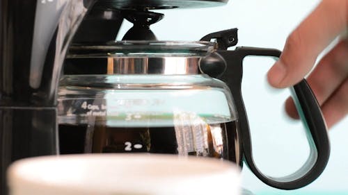 Pouring Coffee On Cup