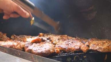 flipping barbecue meat