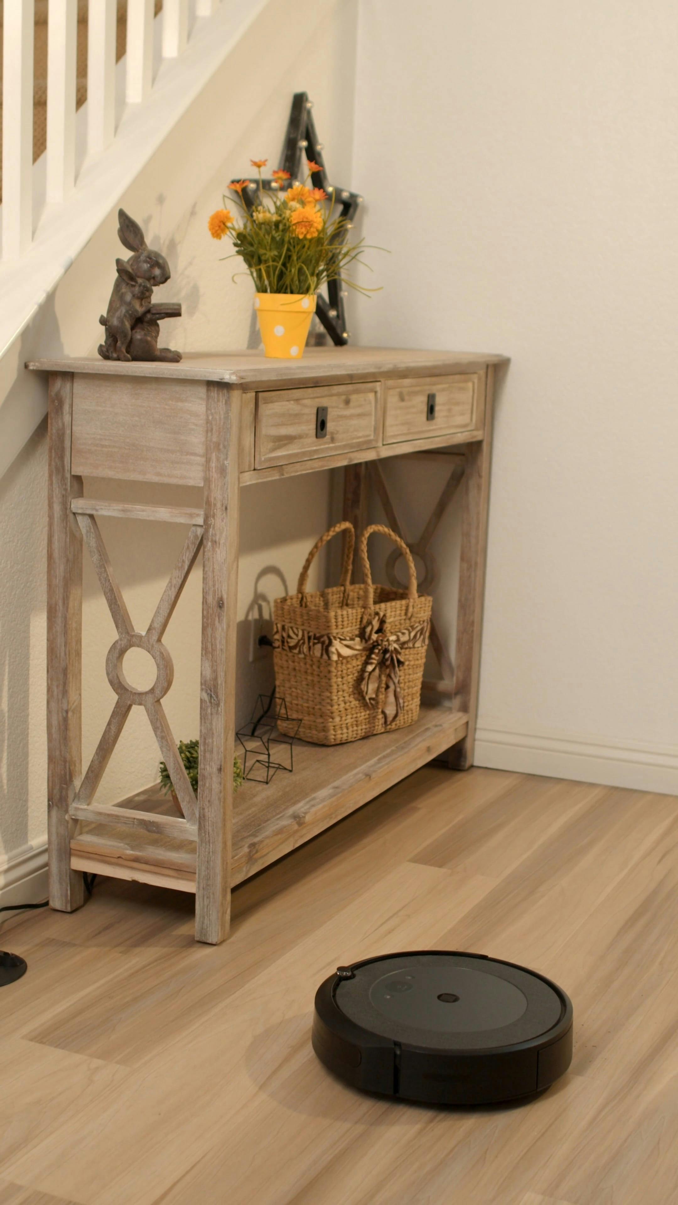 A Robotic Vacuum Cleaning the Floor · Free Stock Video