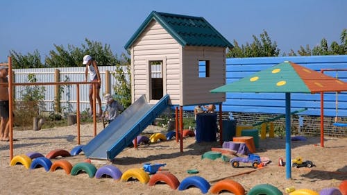 Kids Playing At The Playground