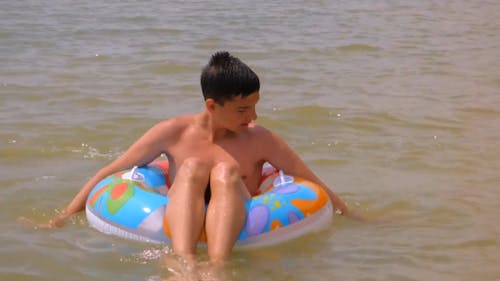 Boy On Floaters