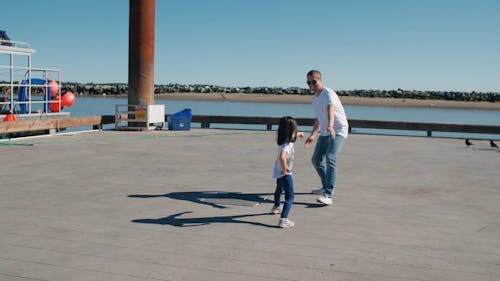 A Father Playing with His Daughter