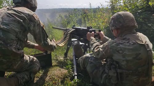 Soldier Firing a Machine Gun