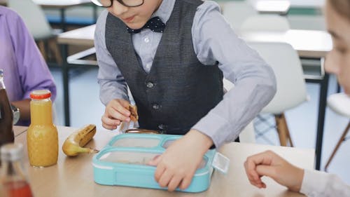 Boy Opening his Lunchbox