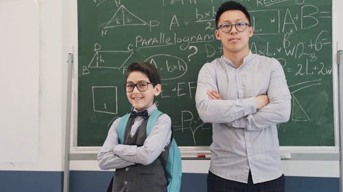 A Teacher and a Student Wearing Eyeglasses
