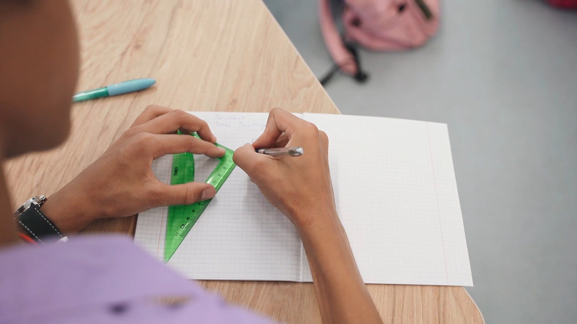 Student Image Square A Student Using a Set Square while Drawing on a Notebook Free Stock ...