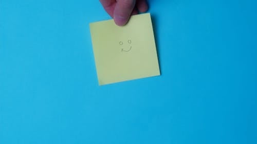 Sticky Note with Smiley Drawing