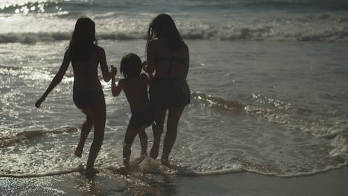 Kids Enjoying Playing on a Beach