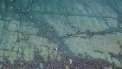 Aerial Footage of Person on the Sea