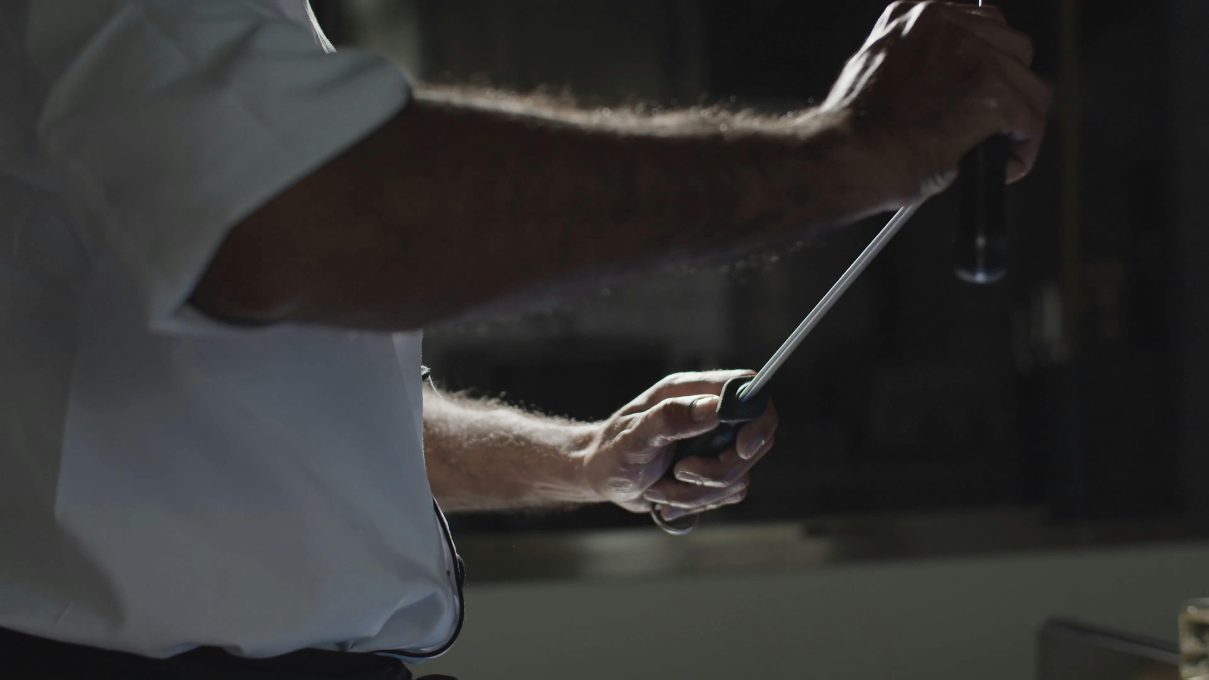 A Man Sharpening the Knife · Free Stock Video