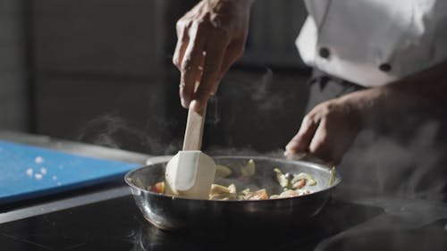 Close Up Video of a Person Cooking Food