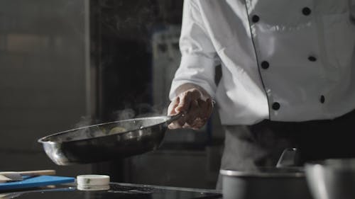 A Chef Flipping a Frying Pan