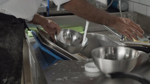 Chef Washing the Utensils 