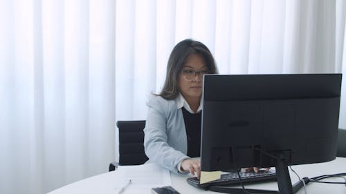 A Woman Working Using a Computer