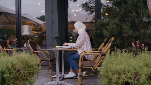 Woman Wearing Hijab Using a Laptop