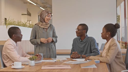 Woman Wearing Hijab Talking in a Meeting