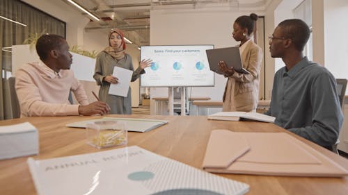 Women Presenting in a Meeting