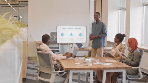 Man Presenting in a Meeting