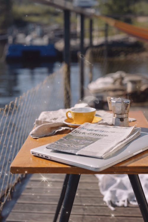 An Animation of a Newspaper and Coffee on a Table