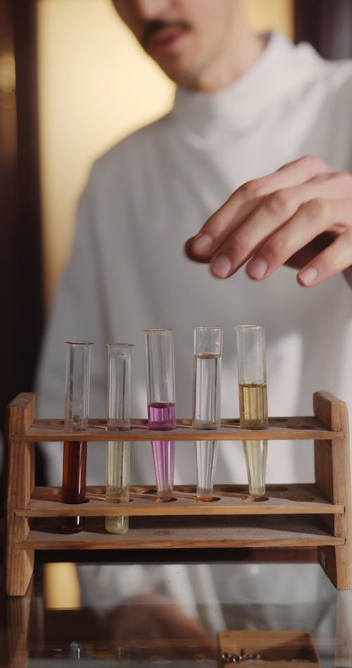 Scientist Looking at Test Tubes