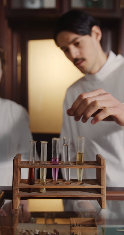 Scientists Looking at Test Tubes