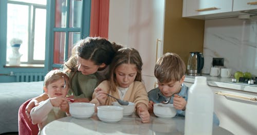 Children Having Breakfast at Home