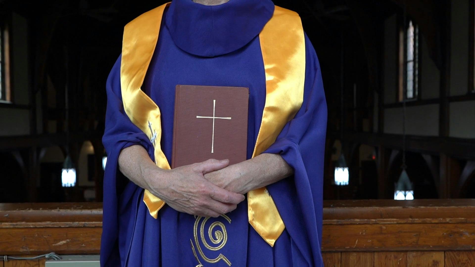 Woman Pastor With Purple Robe Holding A Holy Bible · Free Stock Video