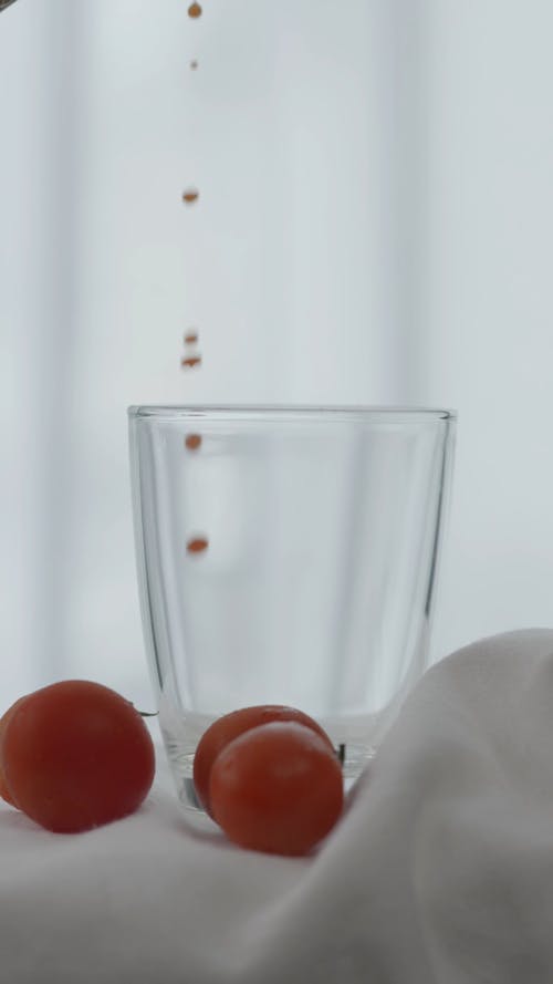 Close up of Tomato Juice Being Poured into a Glass