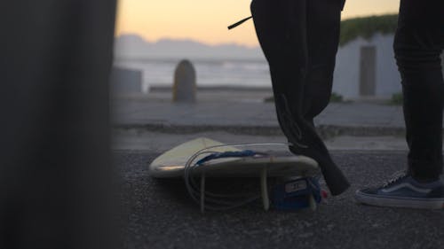 A Man Getting Ready to Go Surfing