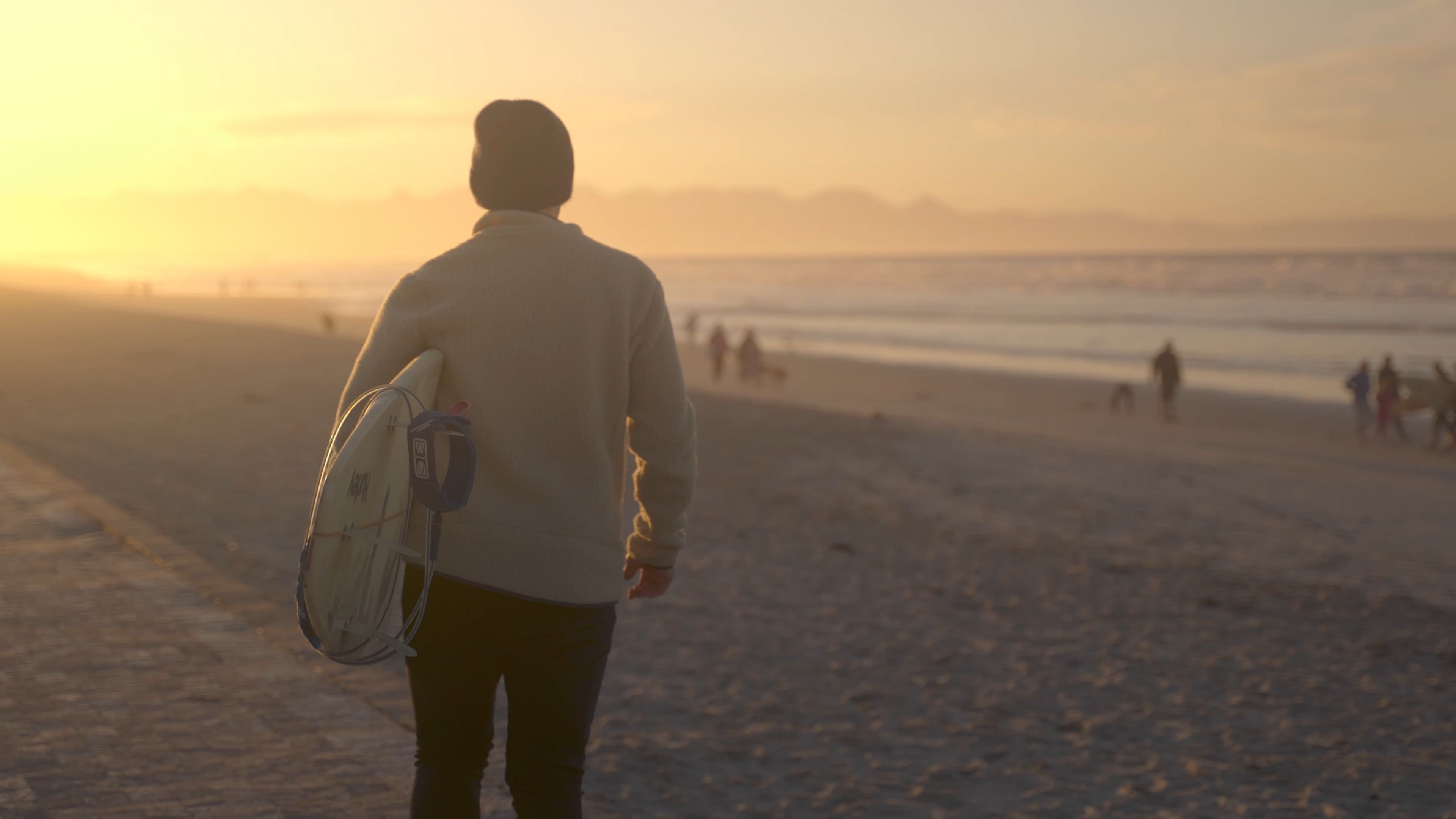 A Man Walking at the Beach While Carrying a Surfboard Free Stock Video ...