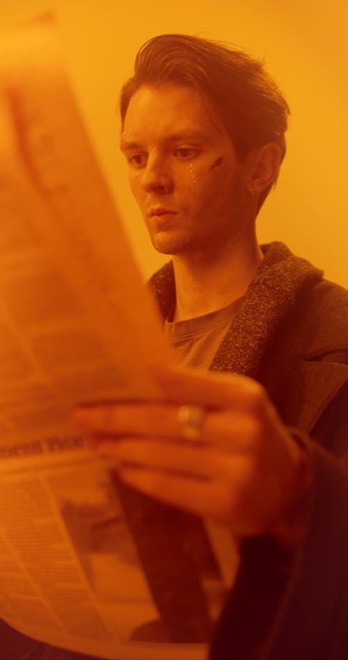 A Man Reading a Newspaper