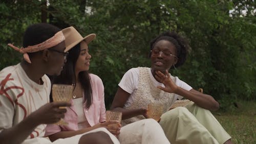 People Sitting on Grass While Hanging Out