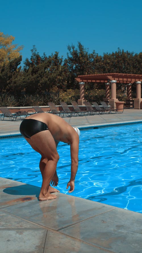 A Man Diving in a Swimming Pool
