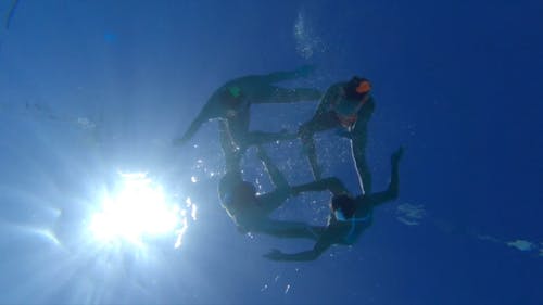 Low Angle Shot of Women Doing Synchronized Swimming