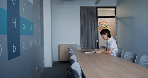 Person Typing on Laptop