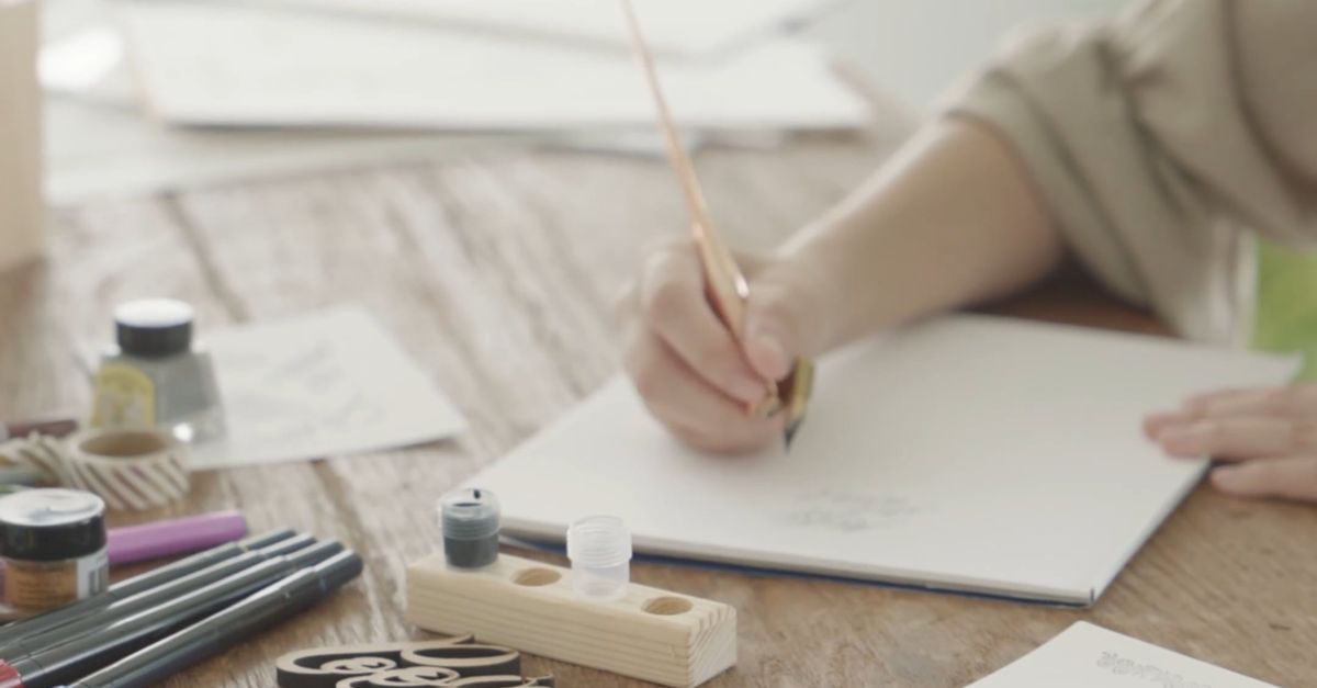 A Woman Doing Calligraphy on a Bond Paper Free Stock Video Footage ...